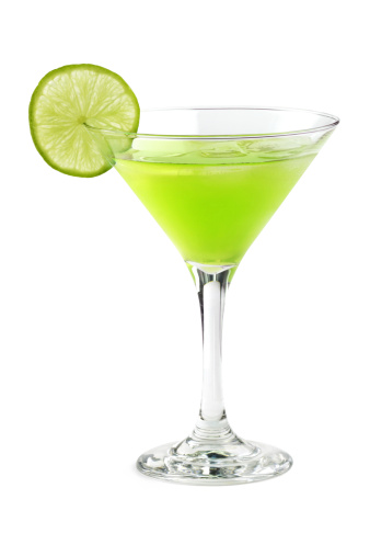 cocktail with a slice of lime in a martini glass