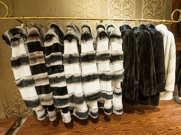 Fur coats hanging on a rail
