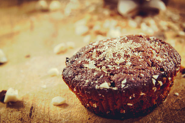 Chocolate muffin with brown sugar and nuts stock photo