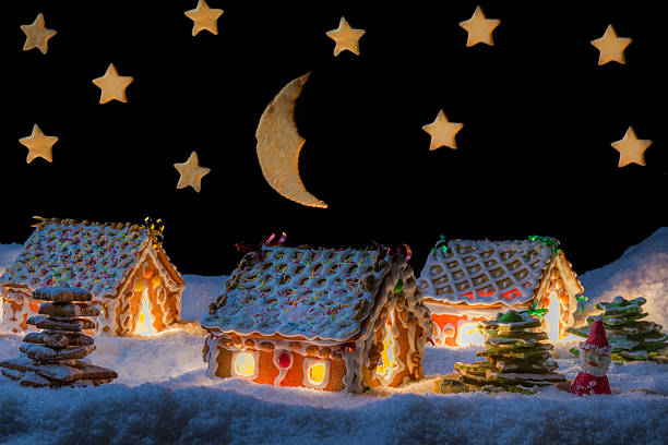 istock Gingerbread lodge with light from the window in winter 462222415