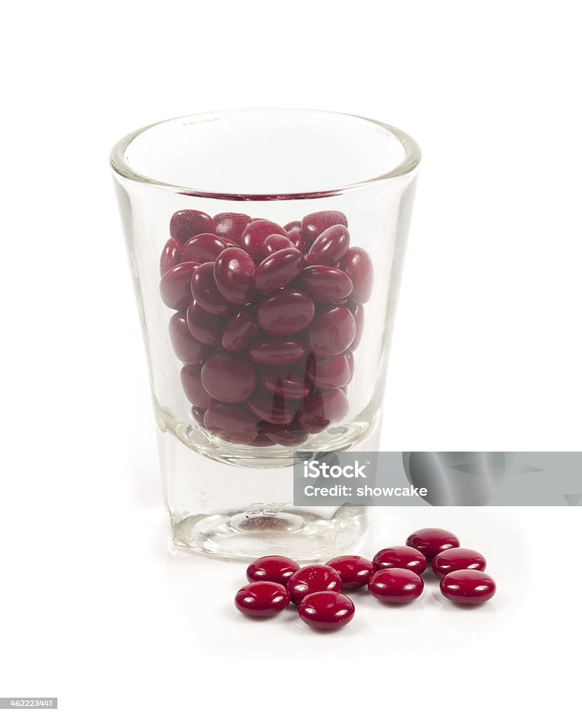 Red pills and pill bottle on white Acetylsalicylic Acid Stock Photo