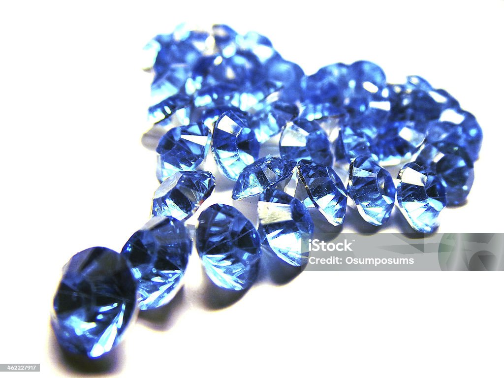 Blue glass crystals with silver back in shape of heart Blue Stock Photo