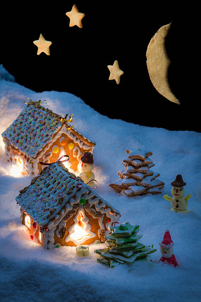 istock Snowy gingerbread cottage with stars and moon 462239069