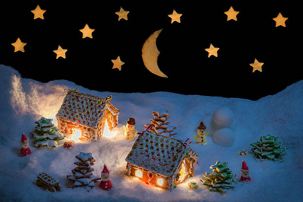 istock Snowy gingerbread village with stars and moon 462239097