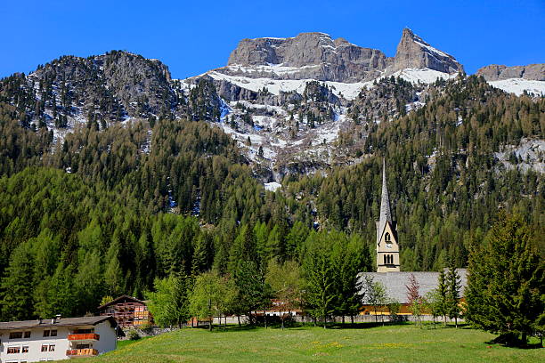Church in Dolomites alps sud tirol pine trees, Italy