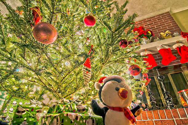 Full length shot of Christmas tree with super many gifts and ornaments
