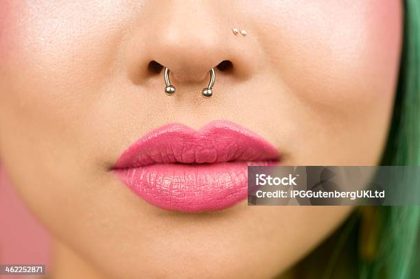 Lips Of Young Woman Wearing Pink Lipstick Stock Photo - Download Image Now - Nose Ring, Pierced, Women