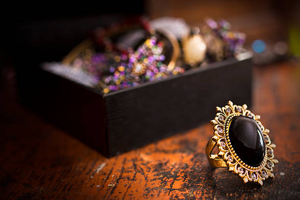 Treasure and jewelry boxes with golden black stone ring stock photo