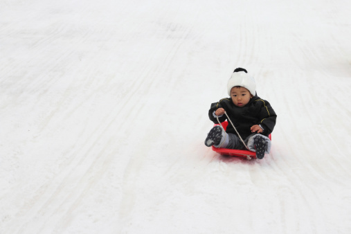 Japanese boy on a sled (3 years old)