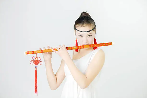 China beauty in blowing the flute