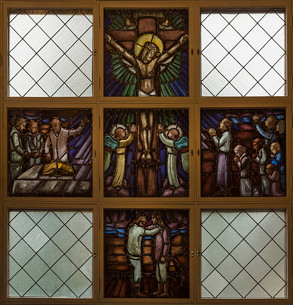 Stained glass window picturing Jesus on the Cross.