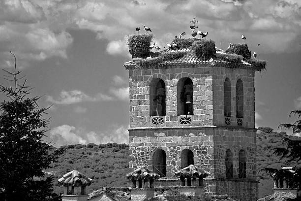 Church tower in Manzanares el Real with storks