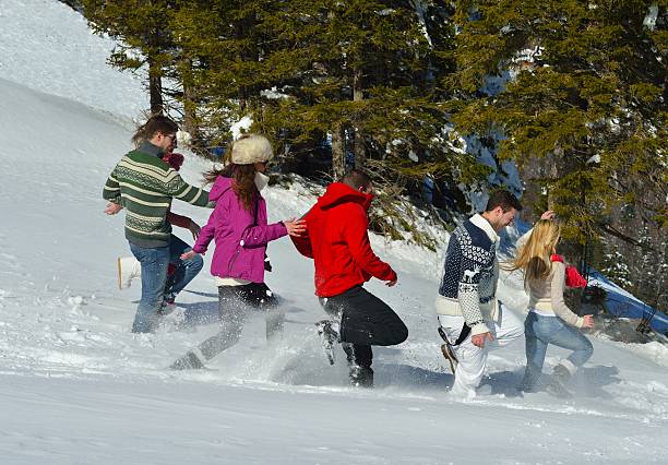 istock friends have fun at winter on fresh snow 462262201