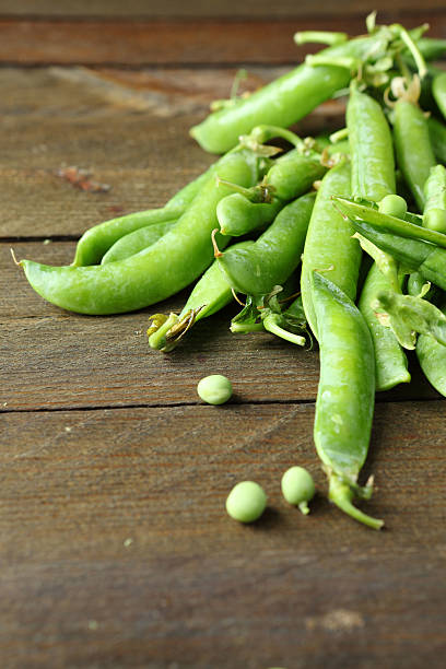 istock handful of green  fresh peas 462263195