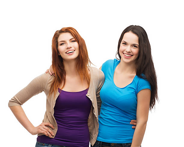 istock two laughing girls hugging 462266525
