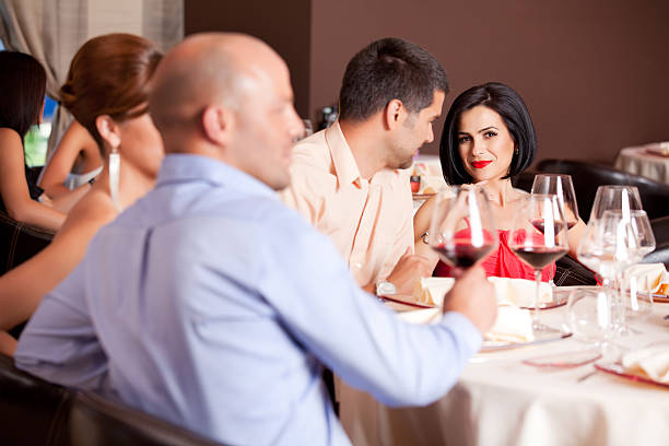 istock happy couple at restaurant table talking 462272969