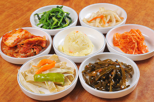 A collection of small white dishes of Korean foods South Korea Food dishes banchan stock pictures, royalty-free photos & images