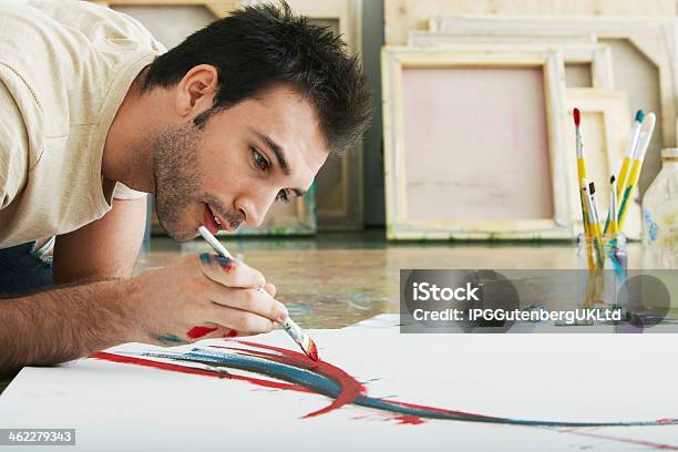 Man Painting On Canvas Studio Floor Stock Photo - Download Image Now - Adult, Art And Craft, Artist