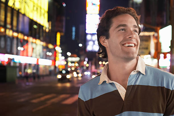 istock Young Man In Times Square New York At night 462279401