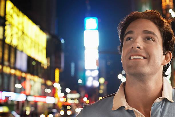 istock Young Man In Times Square New York At night 462279409