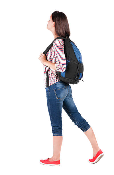 istock back view of standing young beautiful  brunette woman with backp 462281621