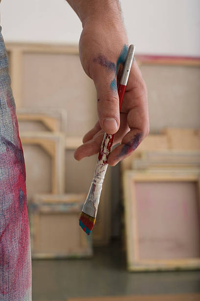 istock Artist's Hand Holding Paintbrush 462281651