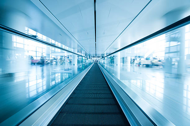 istock escalator, interior of airport 462282163
