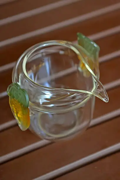 brown glass cup on a desk