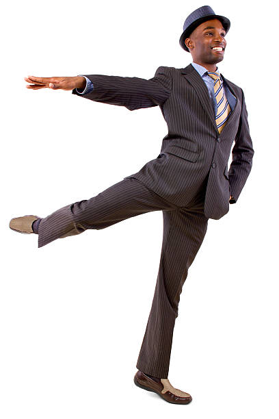 Dancing Businessman in a Suit on a White Background young black businessman in a suit dancing african american male ballet dancer stock pictures, royalty-free photos & images