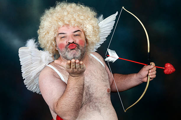 Creepy hairy male Cupid figure Fat bearded mature hairy cupid with bow and heart arrow. Sending a kiss hairy fat man pictures stock pictures, royalty-free photos & images