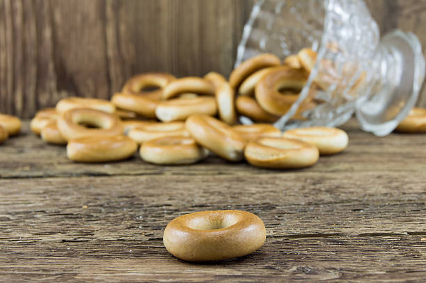 istock Closeup of group assorted bagels on a wood table 462285711