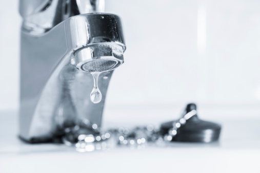 Old faucet leak out, sink in bathroom, tinted black and white image