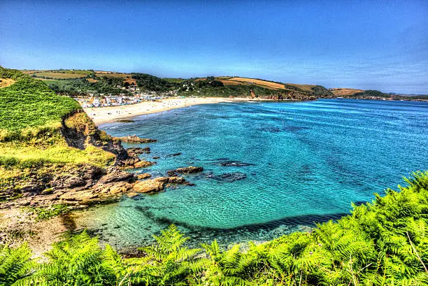 Pentewan beach and coast Cornwall between Mevagissey and Porthpean England UK with turquoise sea in vivid colour HDR like painting