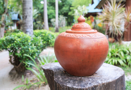 water earthen jar with Thai pattern in the resort, Thailand