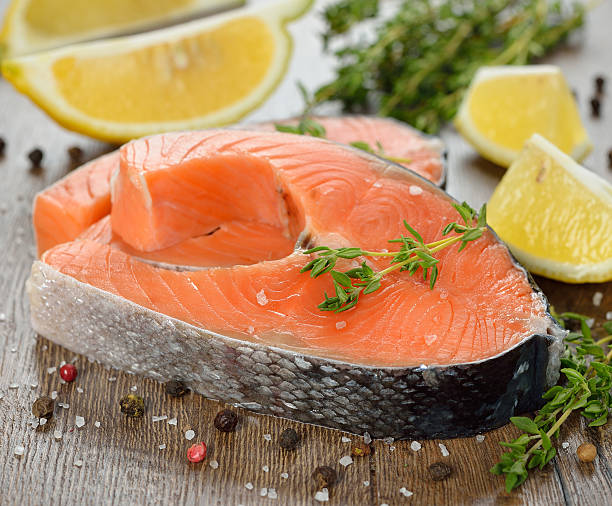 istock Raw salmon with herbs and spices 462293637
