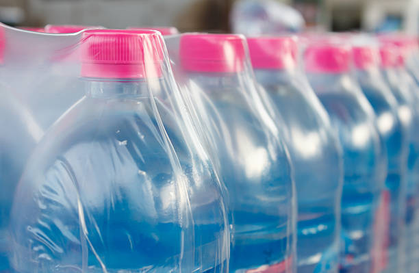 pink lid water bottles in plastic wrap