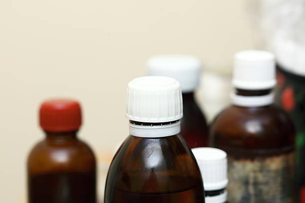 istock Medicine bottles on table indoor 462297273
