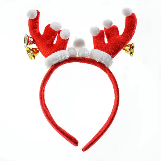 Photo of Funny Santa reindeer headband isolated on white background.