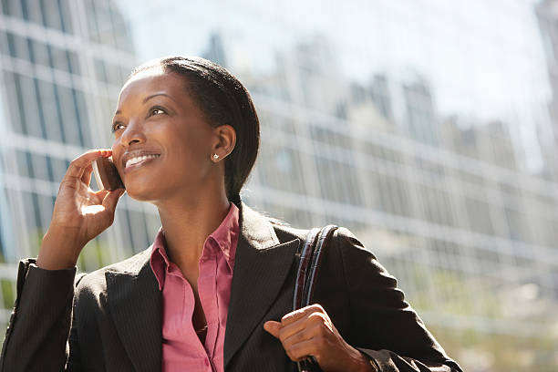 istock Businesswoman Using Mobile Phone Against Building 462301797
