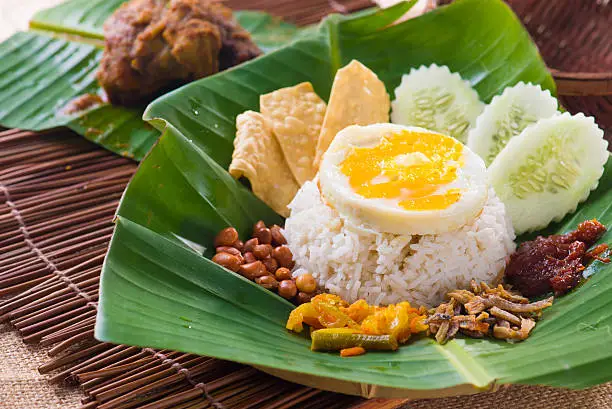Photo of Nasi Kemal, a traditional Malay dish served in a leaf