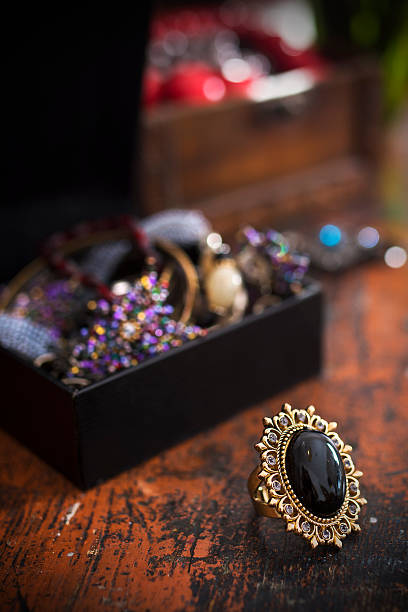 Treasure and jewelry boxes with golden black stone ring stock photo