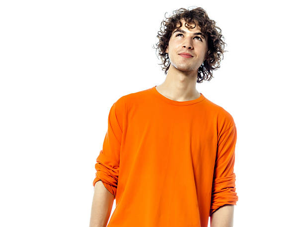 istock young man suspicious looking up portrait 462307195