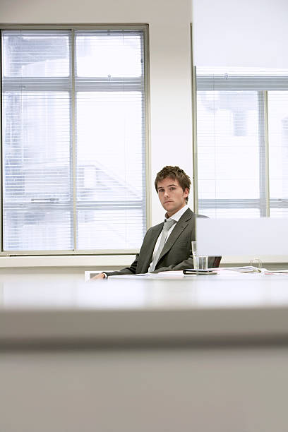 istock Serious Businessman Sitting At Office Desk 462313395