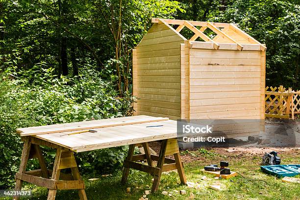 Construction Of A Wooden Hut Stock Photo - Download Image Now - Building - Activity, Shed, Construction Industry