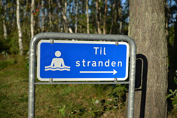 To the beach  - Til stranden !! Danish sign to the beach. Evening summer light at a Baltic Sea beach near Skagen in Northern Denmark denish stock pictures, royalty-free photos & images