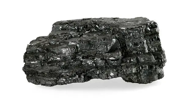 Piece of coal isolated on white background.