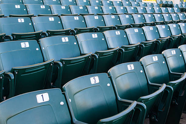 Empty stadium seating in large amphitheater stock photo