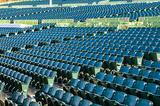 Empty stadium seating in large amphitheater stock photo