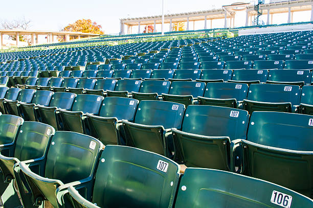 Empty stadium seating in large amphitheater stock photo