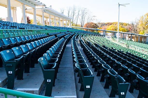 Empty stadium seating in large amphitheater stock photo